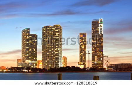 Miami Florida sunset over downtown illuminated business and luxury residential buildings and hotels on Biscayne Bay. Night Cityscape of World famous travel location.