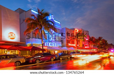 Miami Beach, Florida, Usa-April 5: Illuminated Hotels And Restaurants At Sunset On Ocean Drive On April 5, 2013, World Famous Destination For Nightlife, Beautiful Weather And Pristine Beaches
