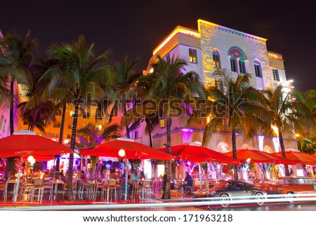 Miami Beach, Florida USA-April 5, 2013:Illuminated hotels and restaurants at sunset on Ocean Drive, world famous destination for nightlife, beautiful weather and pristine beaches