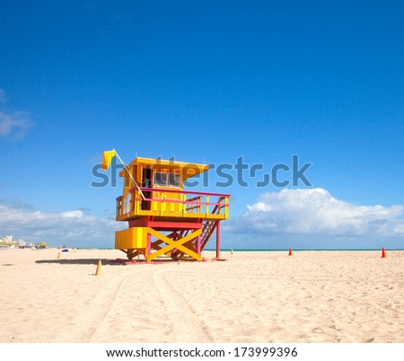 Miami Beach Florida, yellow Art deco lifeguard house on a beautiful summer day with blue sky in the background
