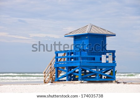Siesta Key Beach, Florida USA, colorful lifeguard house on a beautiful summer day with ocean and blue cloudy sky