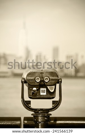 New York city, observation binoculars with downtown view and desaturated instagram filter processing