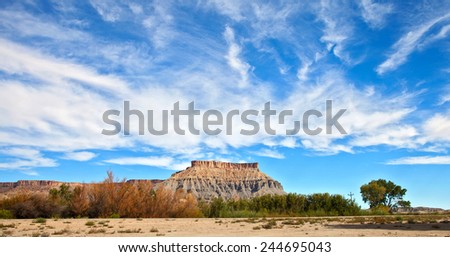 Desert panorama  landscape, red  Mesa hills in Utah, southwest USA on a beautiful summer day with blue sky and clouds
