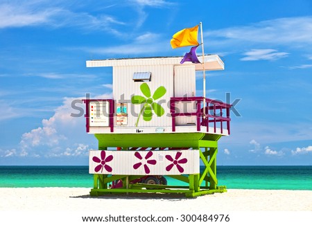 Miami Beach Florida, USA famous tropical travel location, typical Art Deco lifeguard house on a beautiful summer day with ocean and blue sky