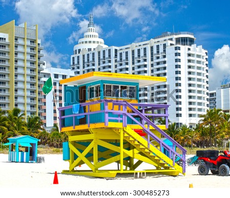 Miami Beach Florida, USA famous tropical travel location, typical Art Deco lifeguard house and hotels on a beautiful summer day