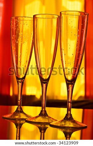 Champagne wine glasses with yellow and orange background
