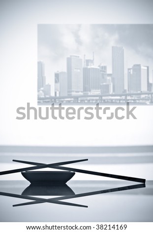 Modern interior with Sushi dinner setup and art photography of Miami buildings on the wall