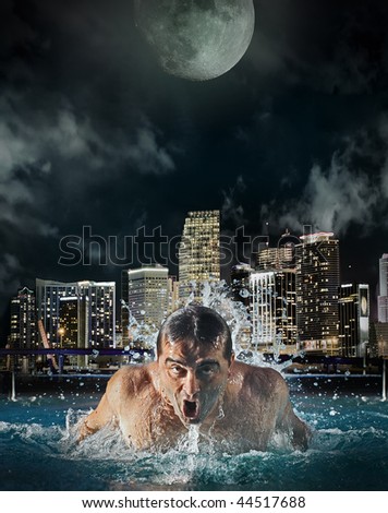 Abstract photo of a man swimming at night in a dark urban setting. Metaphor for strength, power, determination and success.