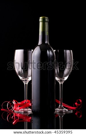 Valentines Dinner setup with two glass and a bottle of red wine