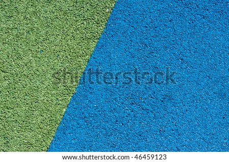 Background texture of blue and green  crumb rubber used for athletic tracks and children playgrounds