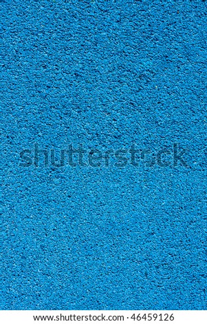 Background texture of blue  crumb rubber used for athletic tracks and children playgrounds