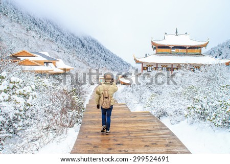 Traveler walking on the snow in Snow season, China