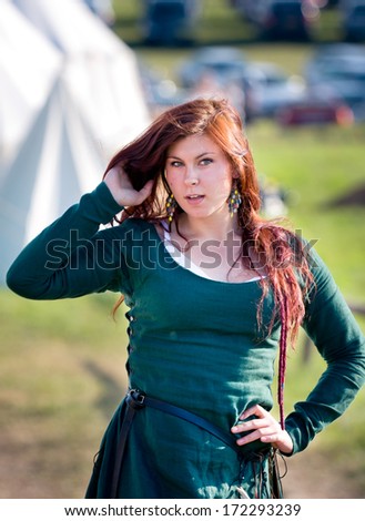 GRUNWALD - July 16: Portrait of beautiful woman of Middle Ages waiting for her knight at Battle of Grunwald 601th anniversary event, 4000 reenactors,1200 knights, near 20k viewers. July 16 2011 Poland