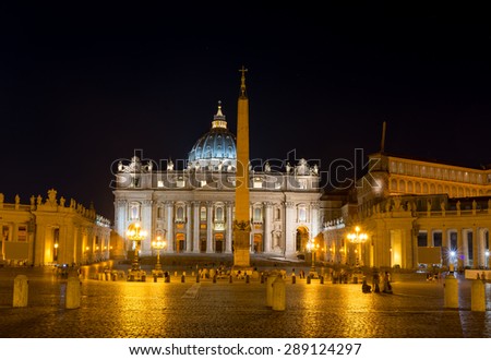 Vatican City at night, long time exposure. Yellow, orange; reflections on the ground.