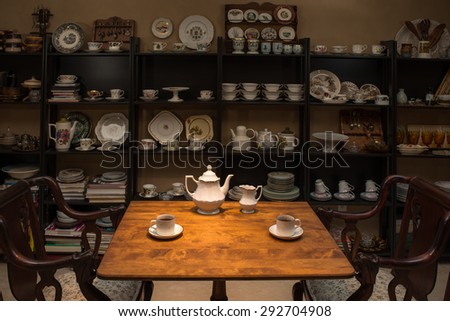 Retro / Vintage style tea room, vintage home interior. Tea time. Antique teacup, antique furniture. Afternoon tea at home.