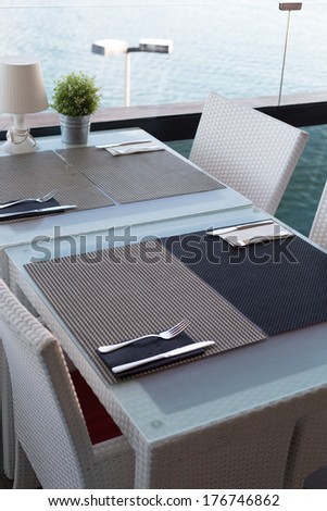 Empty table restaurant overlooking the Mediterranean Sea