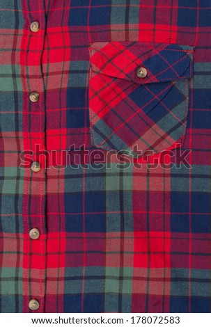 Pocket red and blue plaid shirt close-up.