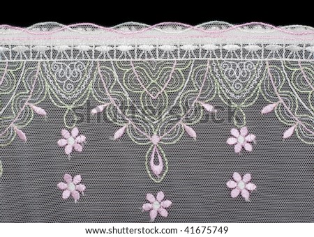 Lace decorated by pattern and decorative rose on black background