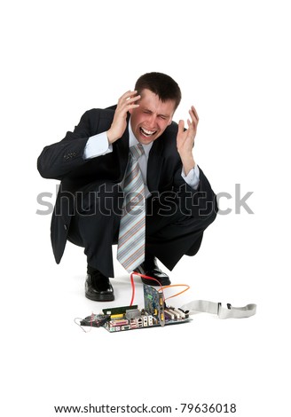 businessman is crying over the broken computer on a white background