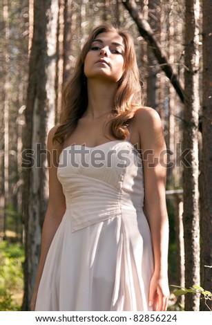 girl in a dress in a forest, a forest fairy