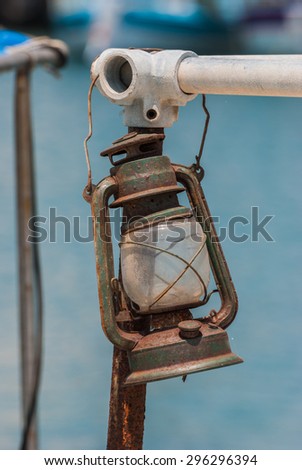 Old rusted lamp on a fishing boat. Close-up