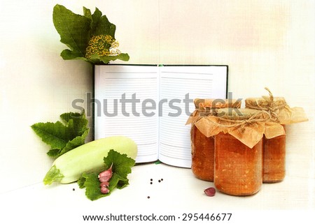 Cooked squash caviar in a banks and blank recipe book with fresh zucchini