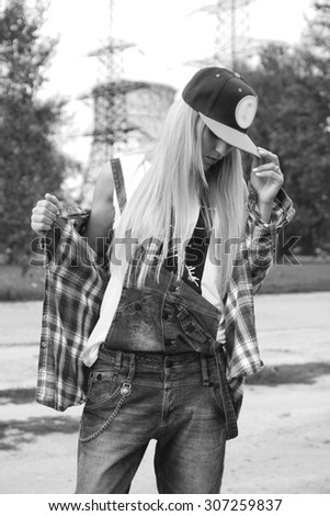 Beautiful modern young woman in a trendy clothes black and white. Youth style. Fashion shot.