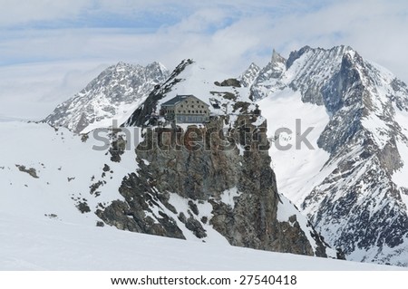 winter mountain landscape with cabin