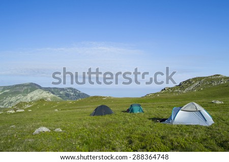 Three tents set up up in the carpathian mountains