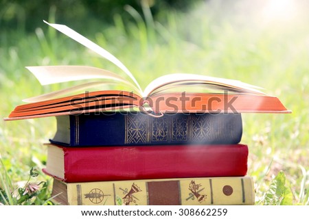 Open book on nature background. Knowledge is power