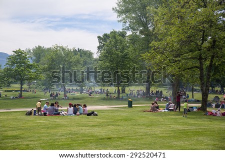 Geneva, Switzerland - May 14, 2015: Genevans filling public parks in numbers on the Ascension day, a public holiday.
