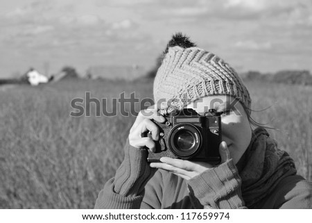 woman with analog camera