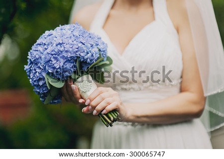 beautiful bridal bouquet of blue hydrangeas
