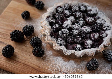 beautiful blackberry pie on a wooden table