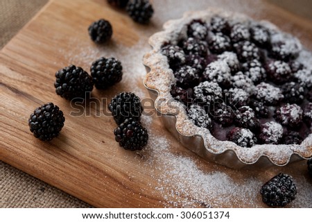 beautiful blackberry pie on a wooden table