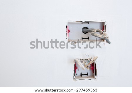 Exposed wiring in an unfinished plug socket - UK