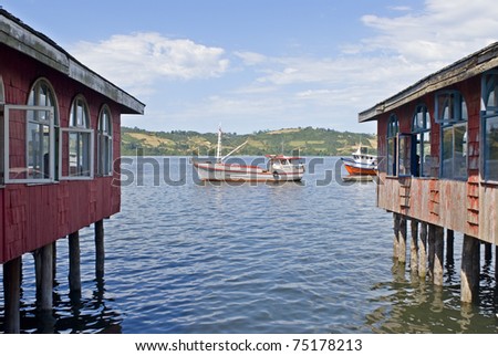 fishing boats and houses on the sea