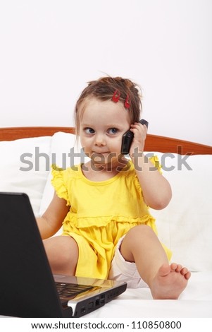 Little girl using modern communication tools