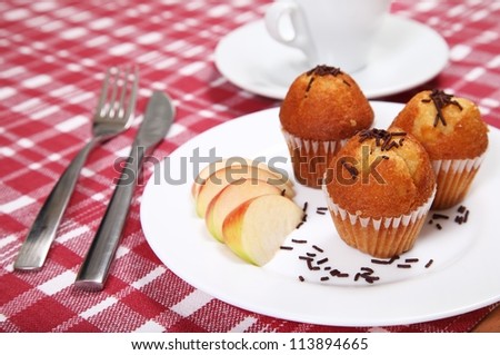 Three chocolate muffins served in restaurant