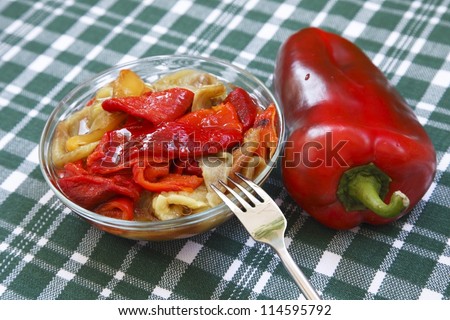 Colorful salad of roasted peppers with one red capsicum