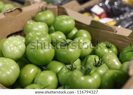 Pickle green tomatoes in a big supermarket