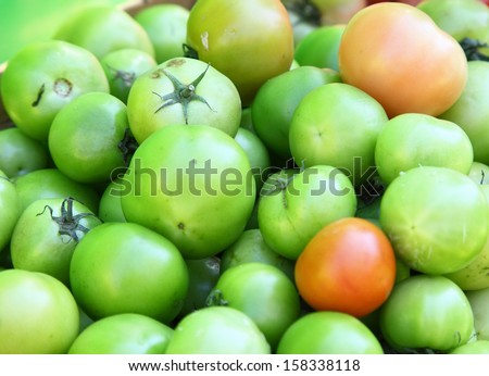 Pickle green tomatoes in a supermarket