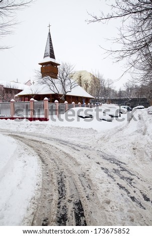 Snowy road in city