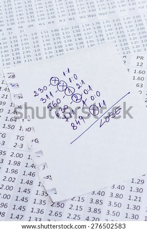 The note with the lose selection of the winning codes on bookmakers