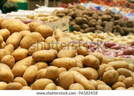 Big potatoes in supermarket stand
