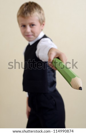 brave schoolboy with big pencil
