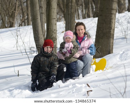 family in the winter forest