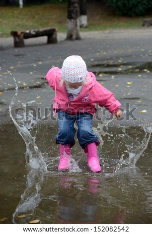 Girl Jumping In Puddles
