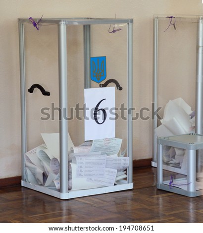 KIEV, UKRAINE - May 25, 2014: Vote for the early presidential elections in Ukraine, voting box with ballots