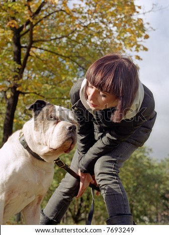 Young woman and strong dog